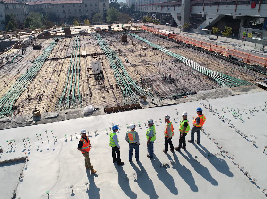 Construction team reviewing work on a building site